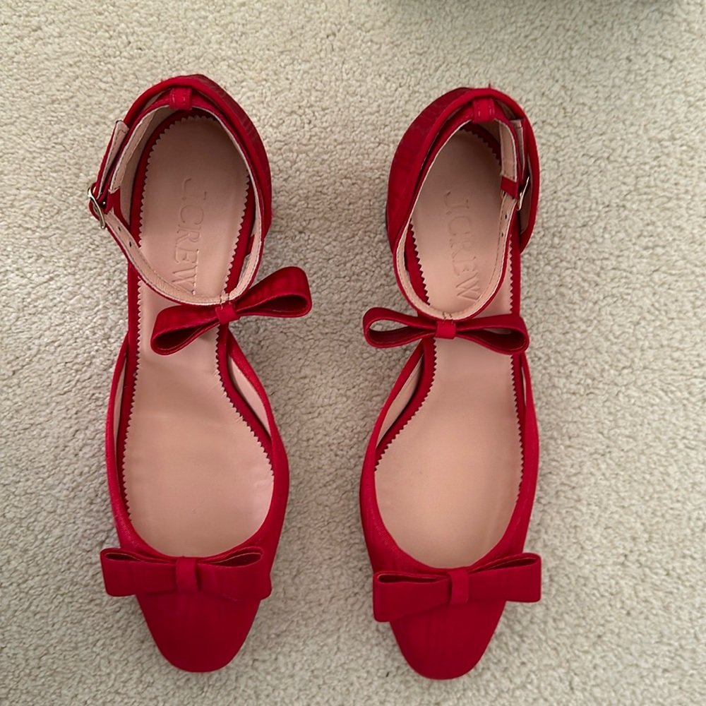 Red satin pumps